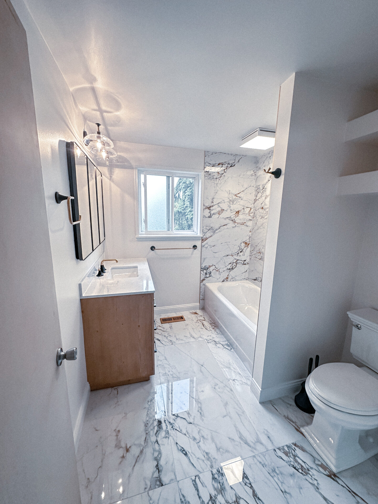Calacatta Marble Bath — Bathroom Remodeling project by JVB Contractors